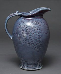 Pitcher with carved grapes